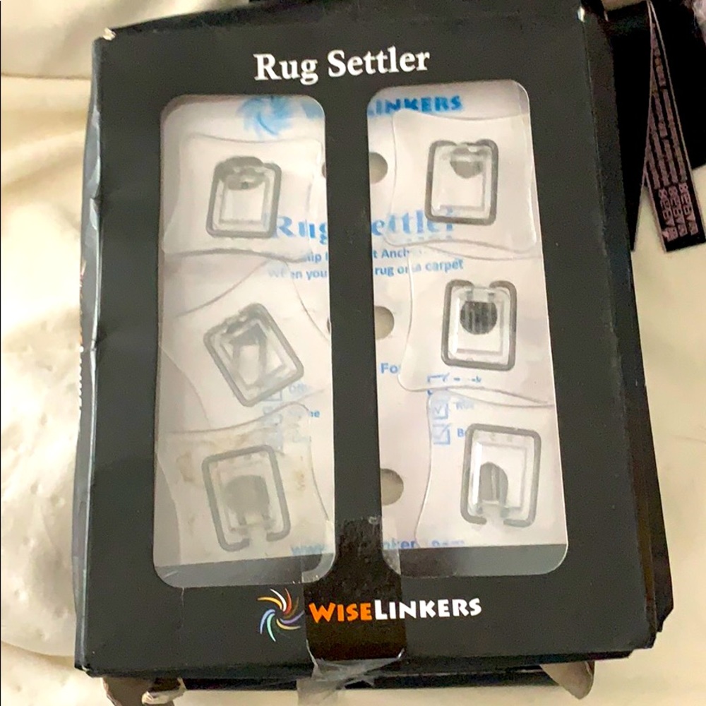 Carpet clips for safely securing rugs to carpets